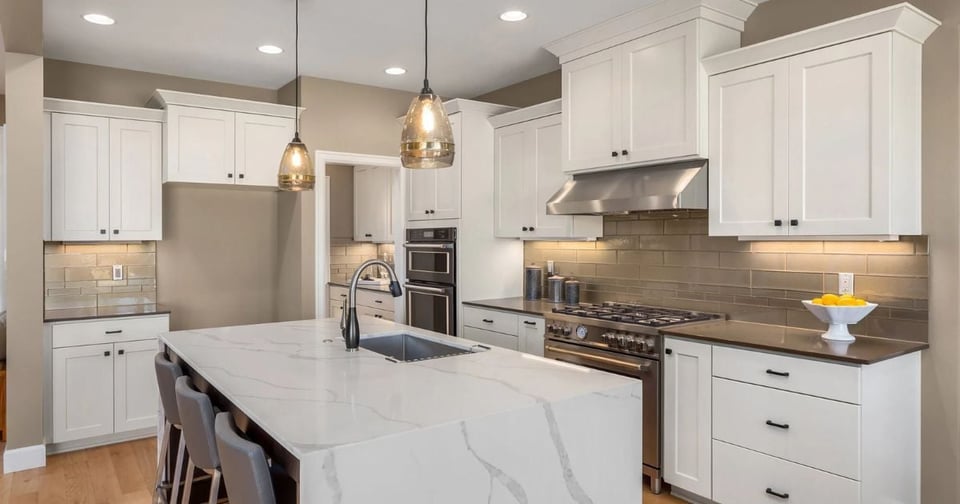 San Antonio kitchen remodel by Wade Caldwell Construction with white shaker cabinets and marble i
