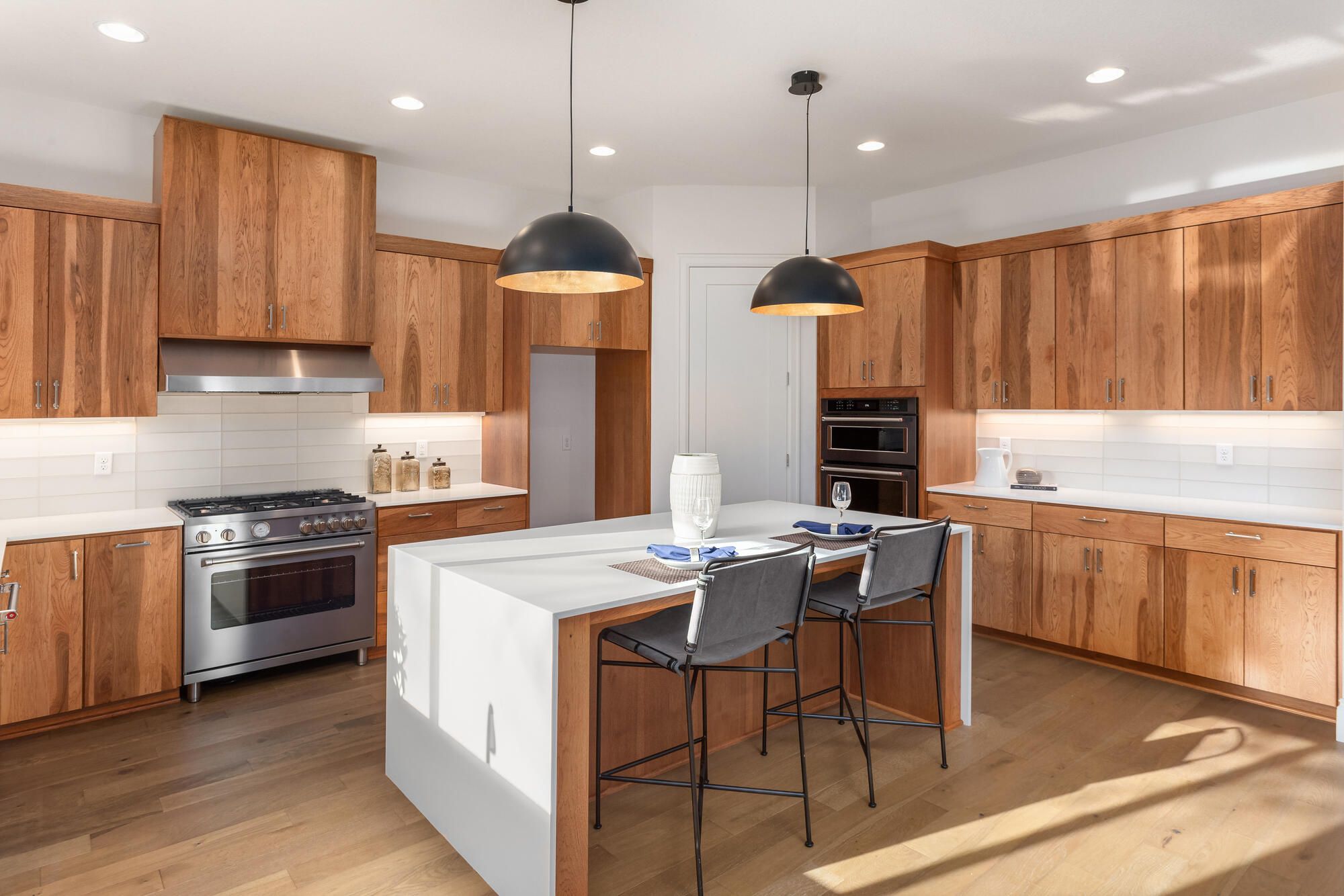 Modern kitchen remodel with warm wood cabinetry and central island by Wade Caldwell Construction in Hollywood Park, TX Modern kitchen remodel with warm wood cabinetry and central island by Wade Caldwell Construction in Hollywood Park, TX