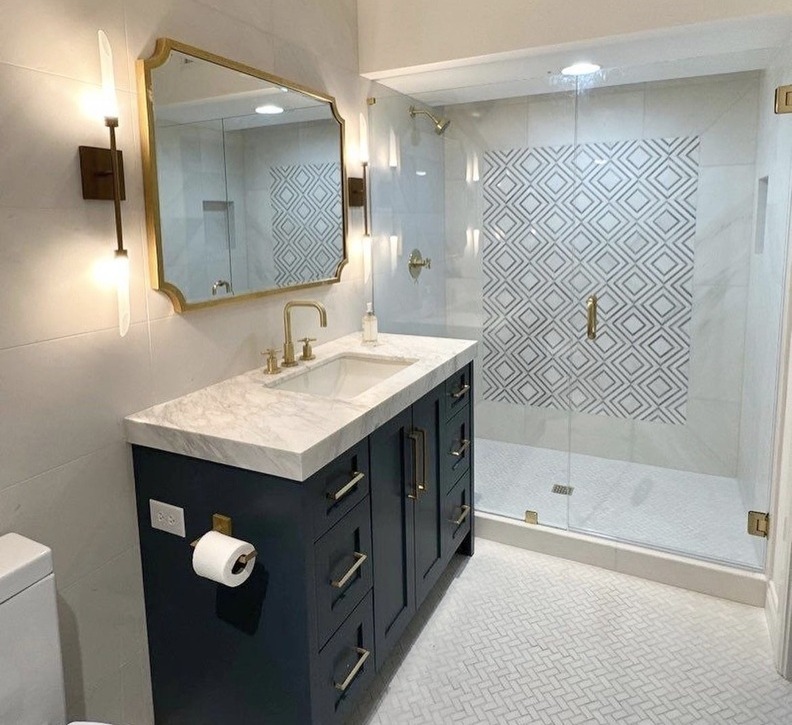 Terrell Hills bathroom features gold fixtures and geometric tile by Wade Caldwell Construction Terrell Hills bathroom features gold fixtures and geometric tile by Wade Caldwell Construction