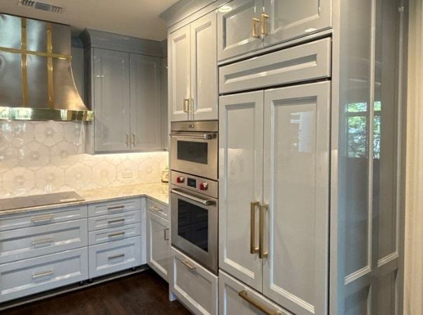 Terrell hills kitchen renovation featuring built-in appliances and white shaker cabinets by Wade Caldwell Construction
