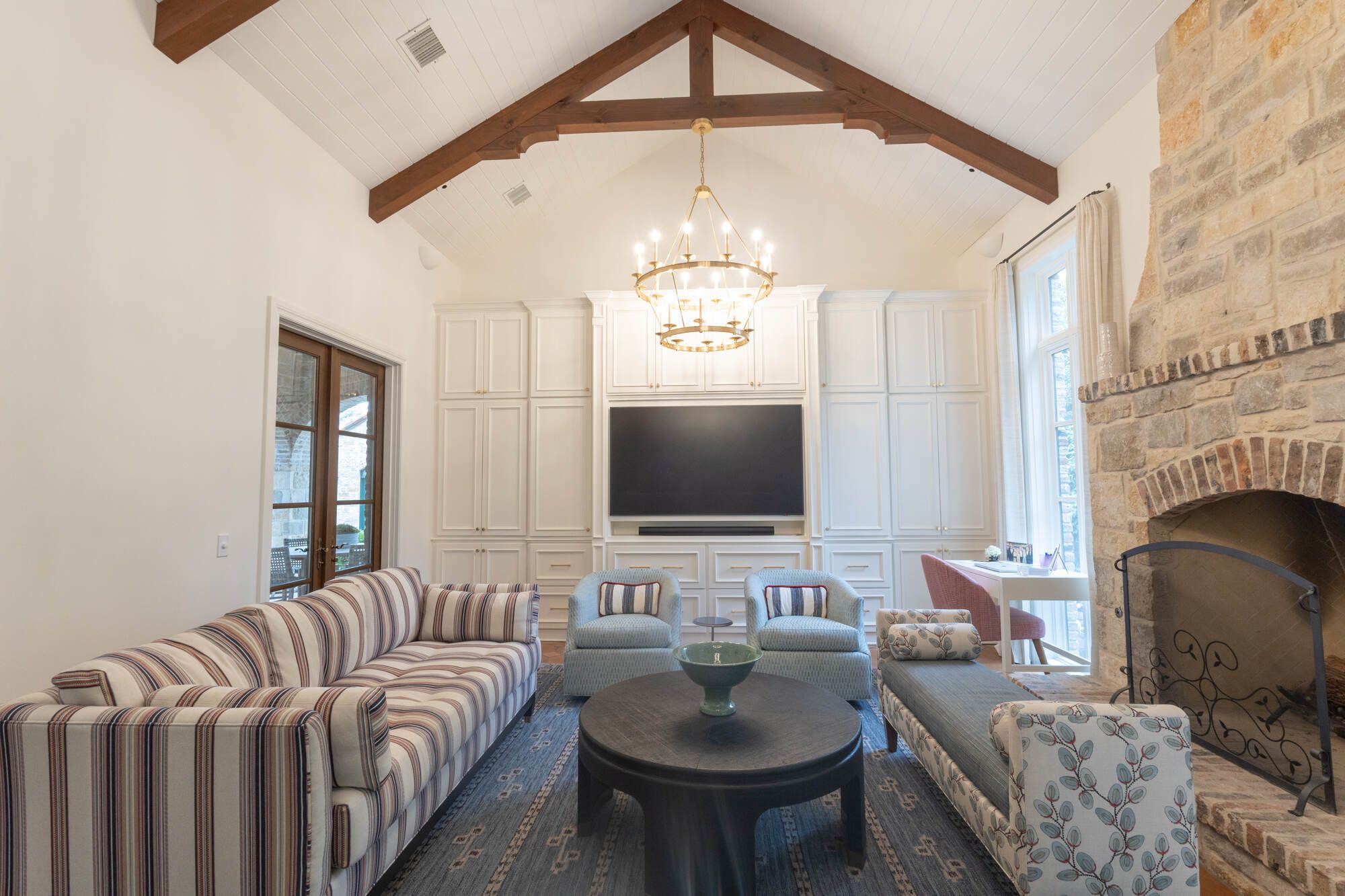 Cozy remodeled living room with rustic accents and modern furnishings by Wade Caldwell Construction in Terrell Hills, TX