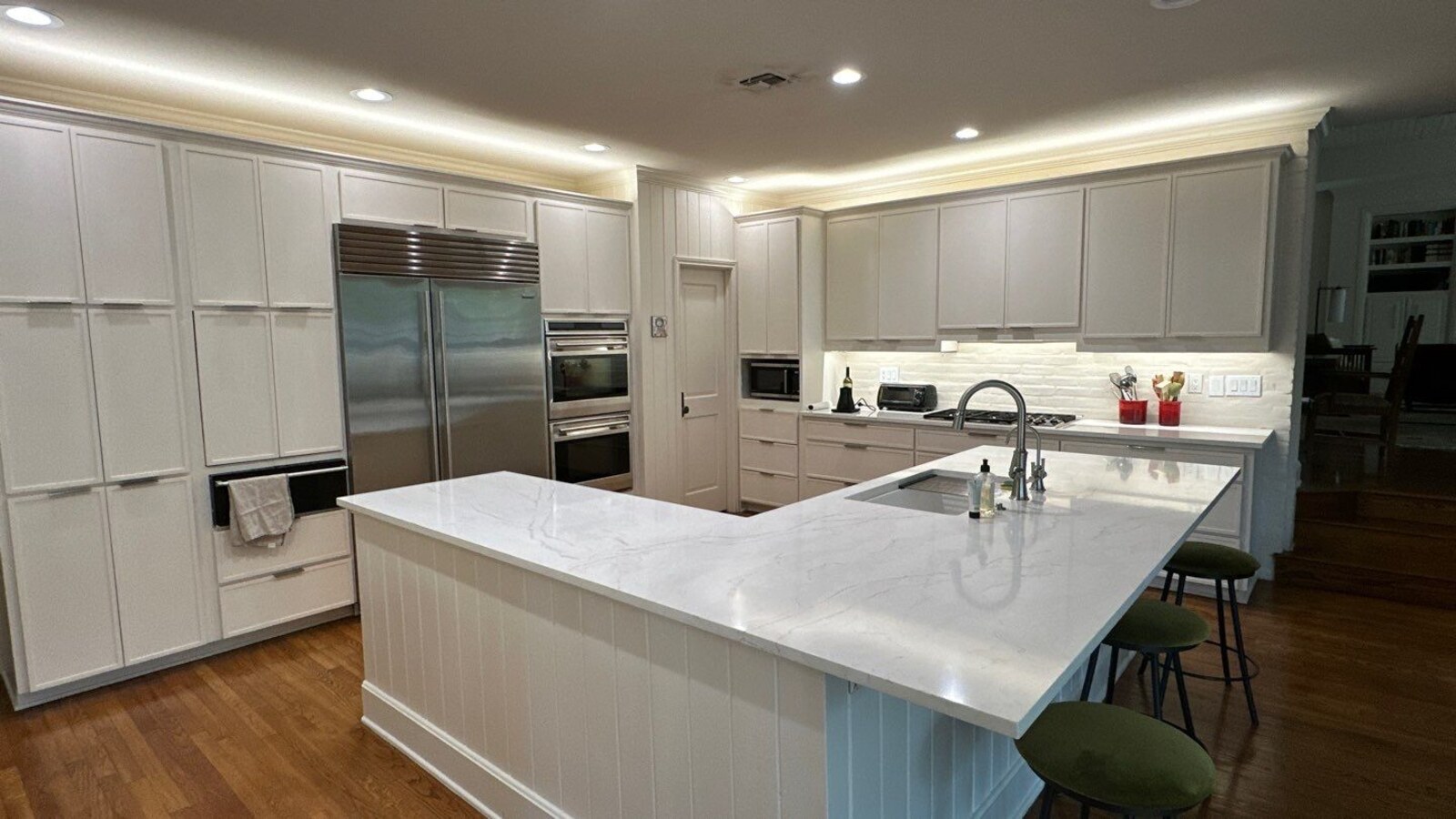 Large U-shaped kitchen with pendant lighting in San Antonio by Wade Caldwell Construction